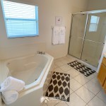 Master Bathroom with large garden tub and a separate shower at Sunshine Villa at Glenbrook Resort, a short-term vacation rental home in Orlando near Walt Disney World