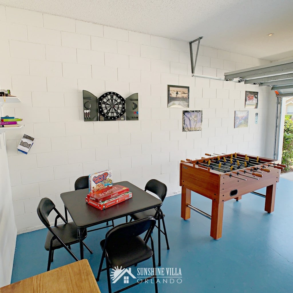 Card table and Foos ball / football table in the Game Room at Sunshine Villa at Glenbrook Resort, a short-term vacation rental home in Orlando near Walt Disney World