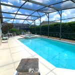 Outdoor Pool with Spa in a screened enclosure at Sunshine Villa at Glenbrook Resort, a short-term vacation rental home in Orlando near Walt Disney World